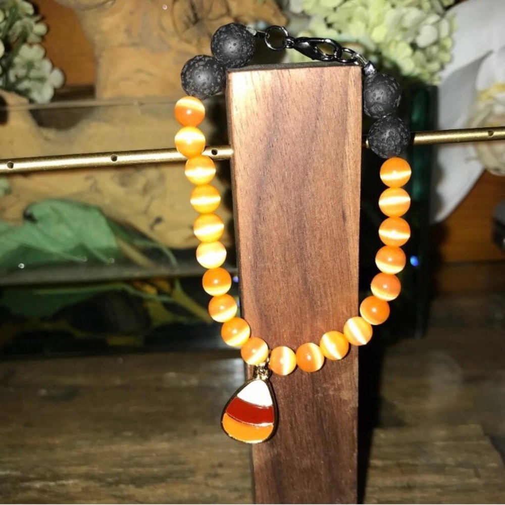 Orange and Black Lava Bead Bracelet with Candy Corn Charm